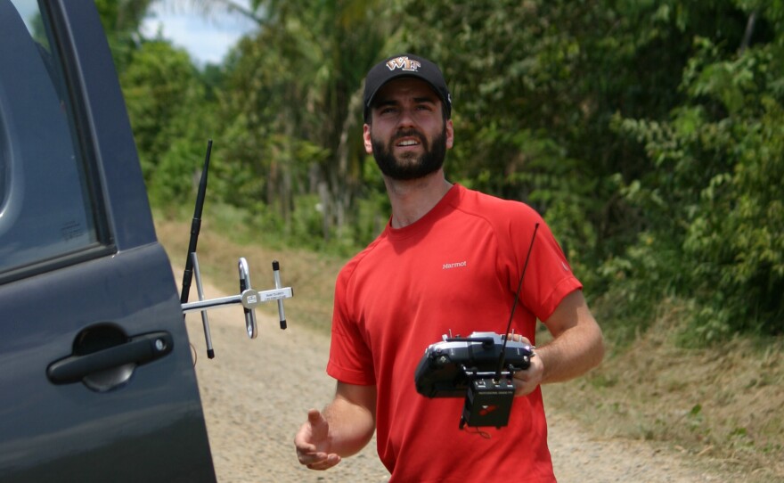 Max Messinger of Wake Forest University flies a drone in the Peruvian Amazon.