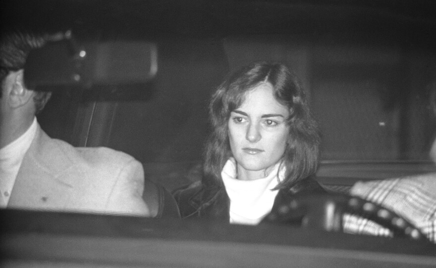 Patty Hearst is seated in a U.S. Marshal's car, leaving the San Mateo County jail in Redwood City, Calif., on Dec. 12, 1975, on her way to San Francisco to an appearance in federal court. Hearst, the granddaughter of newspaper publisher and politician William Randolph Hearst, was tried and convicted on bank robbery charges in 1976, which were later commuted by President Jimmy Carter.