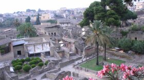 Ariel view of the ruins of Herculaneum, a seaside town in Italy's Bay of Naples. This program explores the ruins of Herculaneum, a city buried and frozen in time by the eruption of Mount Vesuvius in 79 A.D.