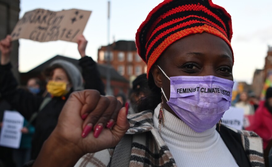 Protesters attend the Global Day of Action for Climate Justice march Saturday in Glasgow, Scotland, where the COP26 conference is being held.