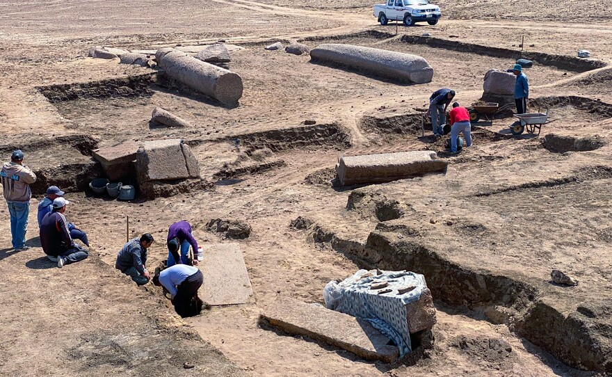 Archeologists work at the Tell el-Farma archaeological site.