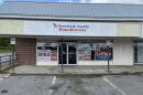 Campaign signs fill the windows of the Aroostook County Republican campaign headquarters in Caribou, Maine.