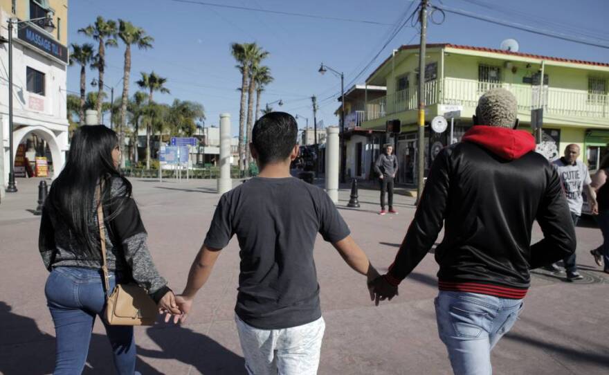 Luna Guzmán walks through Tijuana with friends from Casa Arcoiris, a shelter for LGBTQ refugees from around the world waiting in Mexico to seek asylum in the U.S.
