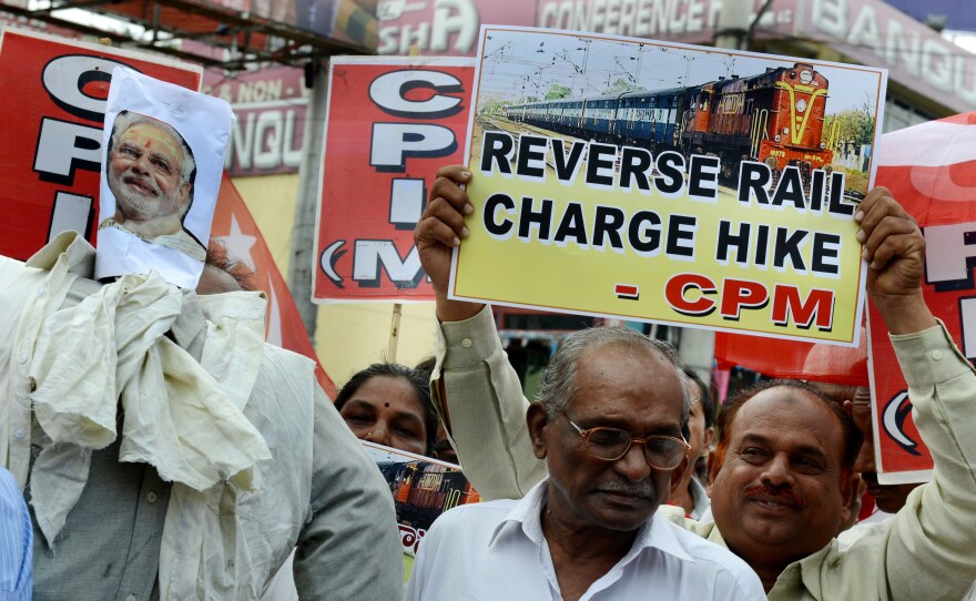Indian activists of the Communist Party of India-Marxists (CPI-M) protest against a price hike in railway fares in Hyderabad, India, on June 21. The government subsequently rolled back a proposed fare increase.