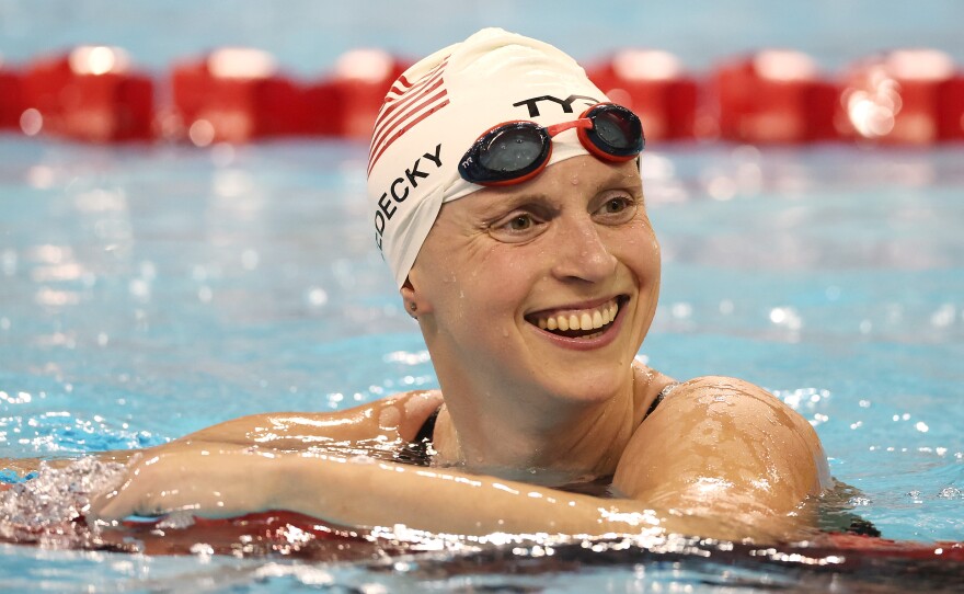 Katie Ledecky reacts after setting a world record and winning the Woman's 1500m Final at the FINA Swimming World Cup in 2022.