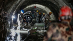 The Nepali Army conducts a search-and-rescue operation on Sept. 10 inside the Chilime Hydropower Station tunnel days after the deadly flash floods and mudslides in Nepal's Rasuwa district in August. In the wake of the disaster, concerns are being raised about the impact of the construction of hydropower plants and dams in the Himalayas.