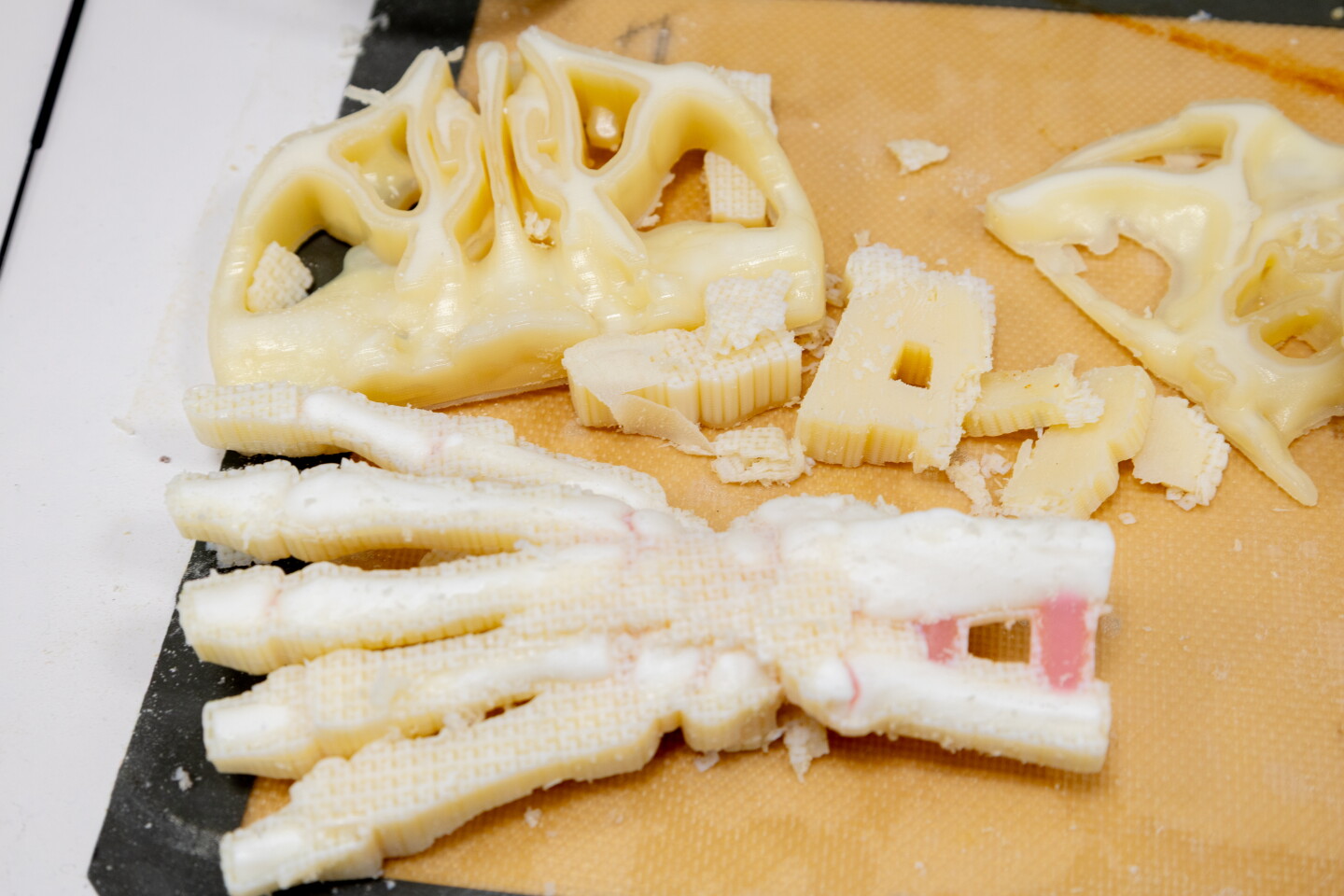 Freshly printed models of a nasal passage and a hand await cleaning to remove excess filaments at Rady Children’s Hospital, Webster Foundation 3D Innovation Lab on August 6, 2026.