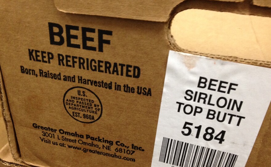 Most beef comes boxed in large cuts that are broken down at the supermarket. The information on the box tells retailers what to say on the country-of-origin label shoppers find on the shelf.