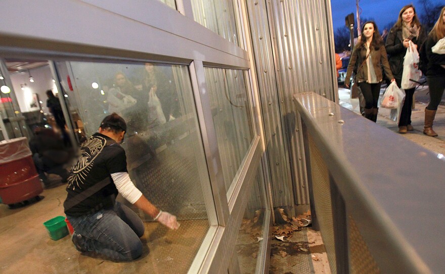 Workers clean a closed Chipotle restaurant in Boston in December after customers became infected with norovirus.