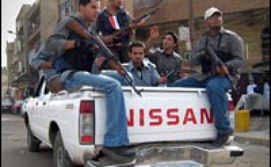 Members of the security group Revolutionaries of Adhamiya patrol the streets of Al Adhamiya, a Sunni district in Baghdad, Nov. 16, 2007.