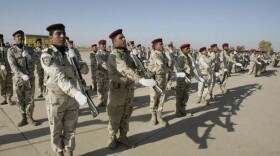 Iraqi soldiers take part in a graduation parade in Kirkuk on Monday. The oil-rich city is a mix of Kurds, Arabs, Turkmen and others. Its future status is a source of tension within Iraq. 