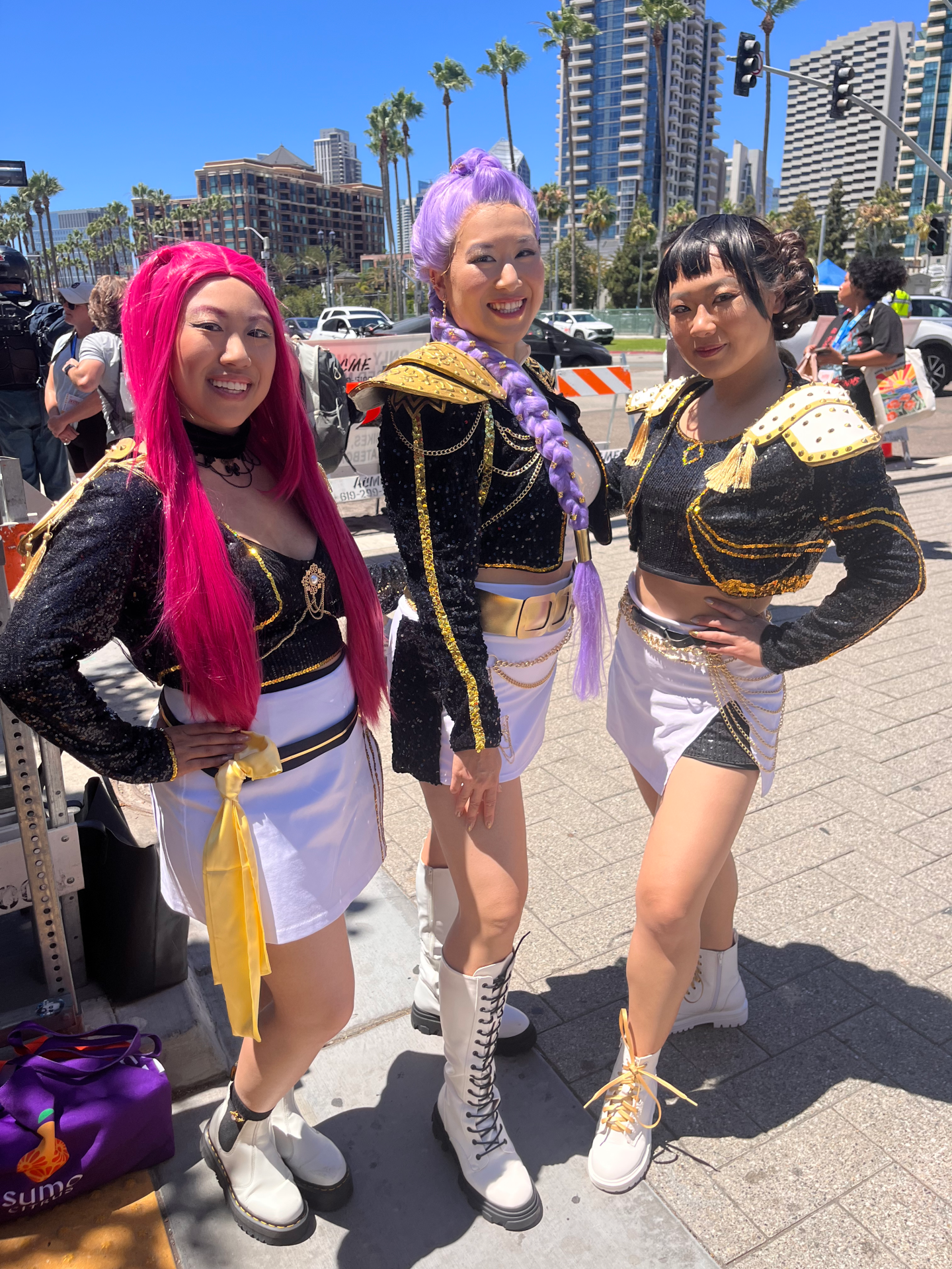 Cosplayers dress as HUNTR/X, the K-pop trio from Netflix's "K-Pop Demon Hunters," at Comic-Con on July 26, 2025. The group — Mira, Rumi and Zoey — double as demon hunters in secret.