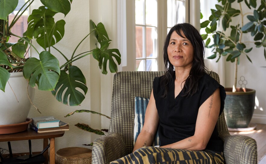 Selena Jong sits for a portrait is a death doula and runs a death cafe every month in Encinitas, Calif. She says people gather to talk about their grief, fears and planning for end of life.