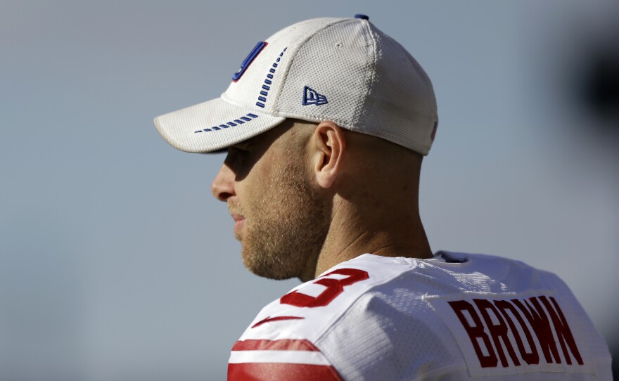 Former New York Giants kicker Josh Brown watches his team play during the second half of a 2013 game against the Philadelphia Eagles in Philadelphia.