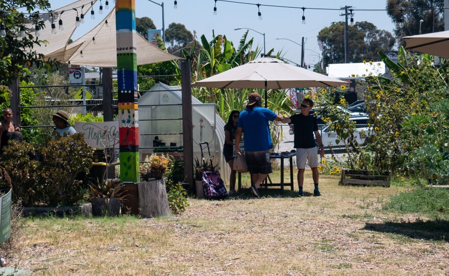 Danny Kaffer, one of the caregivers of Mt. Hope Community Garden, greets a visitor in the garden.