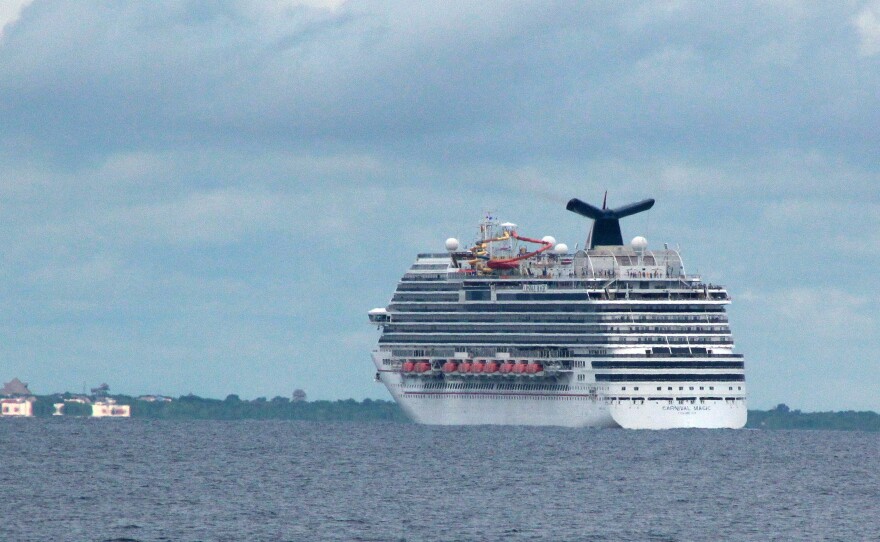 The cruise ship Carnival Magic passes near Cozumel , Mexico, on Friday.