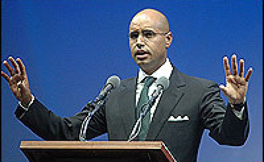 Saif Al-Islam, the son of Libyan leader Moammar Gadhafi, gives a speech.  He outlined plans for a new constitution for Libya, and he stressed that his father was among the "red lines" that could not be changed.