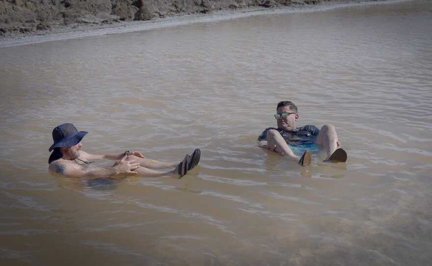 Host Jorge Meraz (right) takes a float with Cristian Hudon in the salt pools north of San Felipe, Mexico.