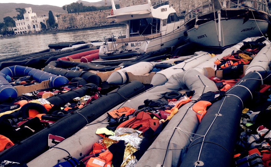 Dozens of rafts used by by refugees and migrants, mainly from Syria, Afghanistan and Iraq, to cross from the Turkish coastal district of Bodrum to the Greek island of Kos, sit empty by the seashore.