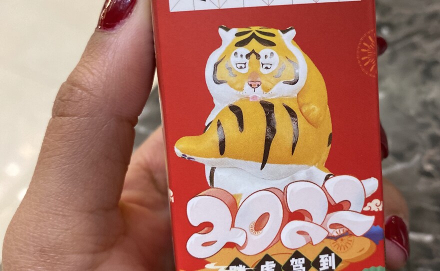 In honor of the Chinese Lunar New Year being celebrated within the tightly-controlled Beijing Olympics, volunteers gave out Year of the Tiger figurines to guests.