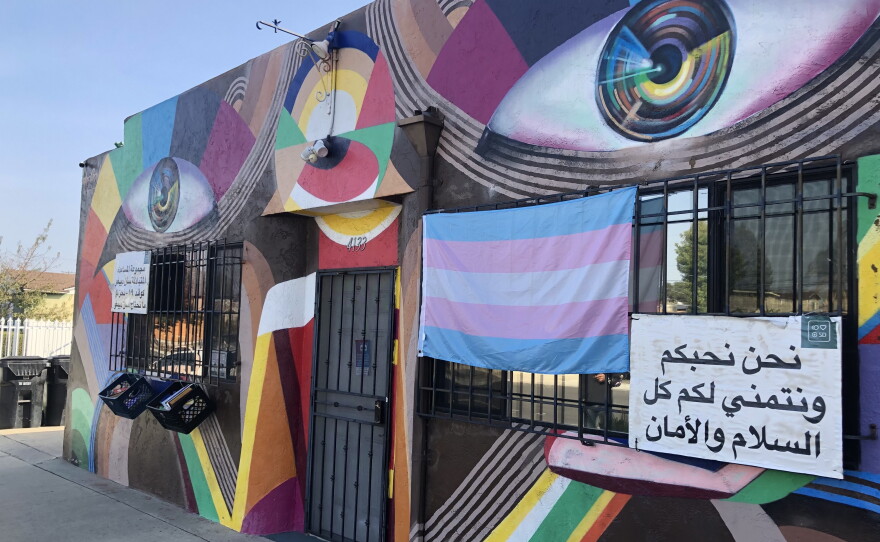 A sign in a foreign language is seen on the vivid, artistic exterior of The Brown Building in City Heights, Dec. 6, 2021