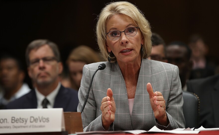 Education Secretary Betsy DeVos is accused of unlawfully delaying a federal rule stemming from the Obama administration.