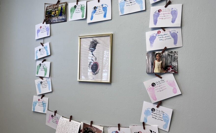 Baby's footprints decorate the wall at Tiffany Townsend's office.