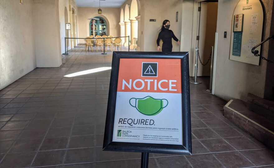 A sign indicating masks were required at The Prado restaurant in Balboa Park, Dec. 5, 2020.