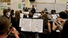 Cameron Brown warms up the University City High School band before a performance. Brown is taking a teaching job in Colorado after two consecutive years of being laid off.
