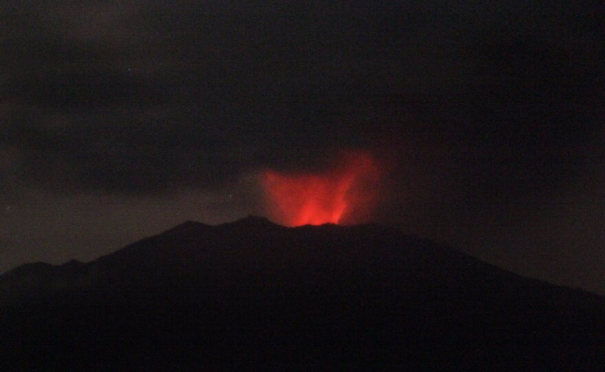 Mount Raung spews volcanic materials as seen from Sumber Arum village in Banyuwangi, East Java, Indonesia, on Friday.