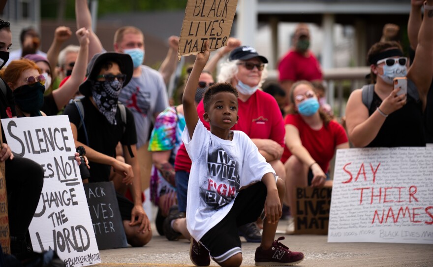 Amari Jackson, 7, holds up a Black Lives Matter sign during a peaceful protest against police violence in Bridgeport, Pa., on June 3.