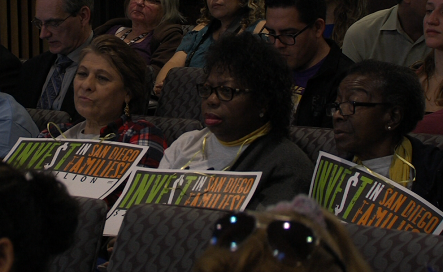 Opponents gathered in the County Administration Building as the San Diego County Board of Supervisors voted to give themselves a raise, Jan. 10, 2016.