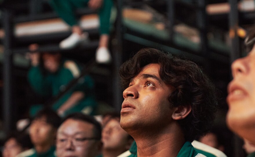 The character Ali Abdul (portrayed by actor Anupam Tripathi) is a Pakistani migrant worker in South Korea whose boss hasn't paid him in months. Ali joins a secret competition called Squid Game to earn money for his family.