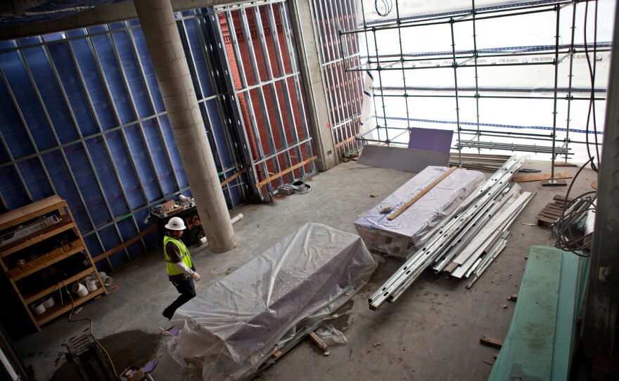 A view of construction underway, showing what will eventually be open community space at the John and Jil Ker Conway Residence.
