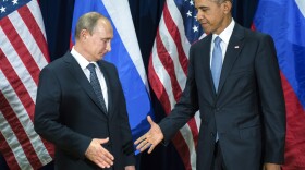 U.S. President Barack Obama, right, and Russia's President Vladimir Putin pose for members of the media before a bilateral meeting Monday, Sept. 28, 2015, at United Nations headquarters.