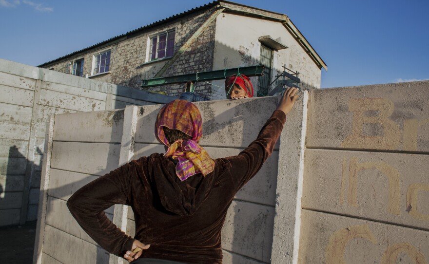 Debbie (left) and her neighbor, Naznuna Esau. 2014.