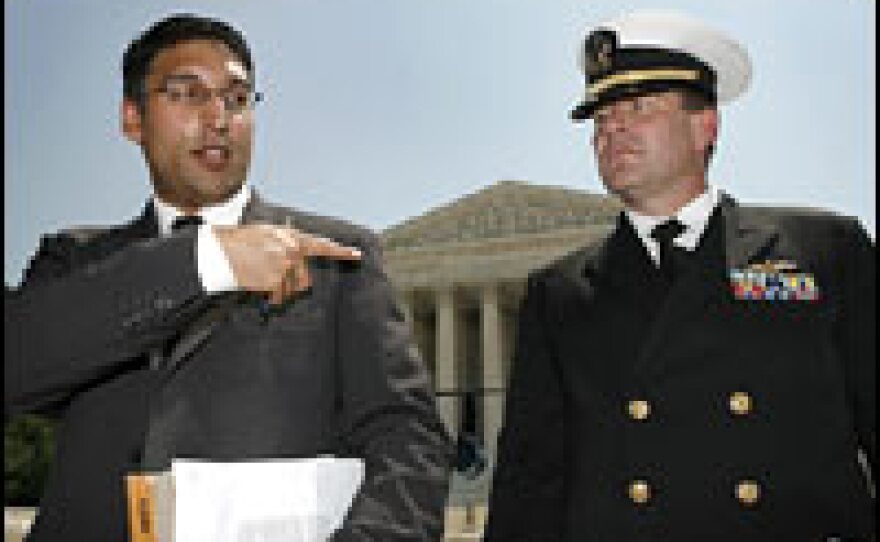 Attorney Neal Katyal, left, and U.S. Navy Lt. Cmdr. Charles Swift, who represented Guantanamo Bay detainee Salim Ahmed Hamdan, speak after the Supreme Court ruled against proposed military tribunals June 29, 2006.