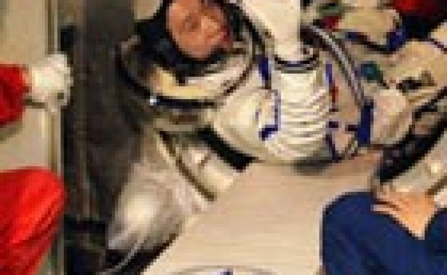 China's first astronaut, Yang Liwei, 38, boards the Shenzhou 5 space vehicle at the Jiuquan Satellite Launch Center, in the northwestern province of Gansu, Oct. 15, 2003.