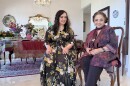 Susie Ghahremani (at left) and her mother, Zohreh Ghahremani, are shown in front of Zohreh's Nowruz spread and haft-seen on March 17, 2026. The two recently collaborated on the children's book "Celebrate Nowruz."