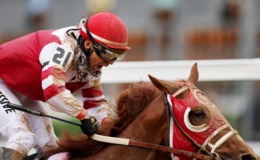 Jockey Sonny Leon reacts as Rich Strike wins the 148th running of the Kentucky Derby at Churchill Downs on Saturday.