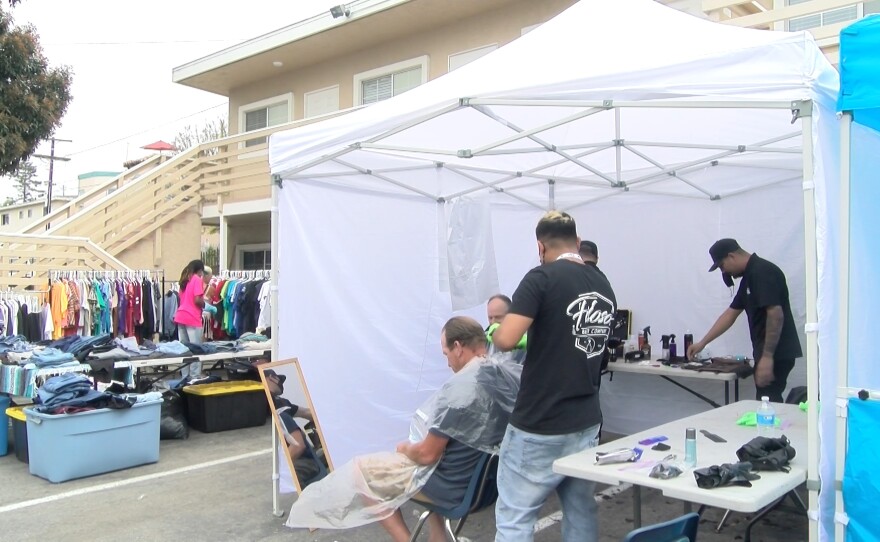 Barber services and clothes offered at the Humanity Showers event at Potter's House in Oceanside. May 12, 2021.
