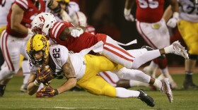 Minnesota wide receiver Drew Wolitarsky (82) makes a catch while being defended by Nebraska safety Kieron Williams, top, during the second half of an NCAA college football game in Lincoln, Neb, Nov. 12, 2016. 

