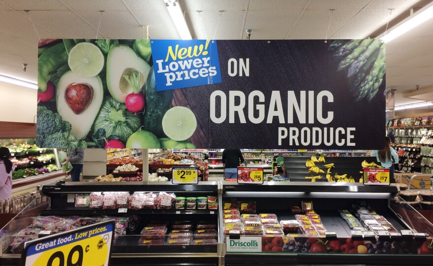 Produce is often accompanied by signs like this one at a King Soopers grocery store in Fort Collins, Colo. But customers are often confused by their meaning, which is one reason the Organic Trade Association is trying to raise money for a "checkoff" to pay for consumer advertising and research.