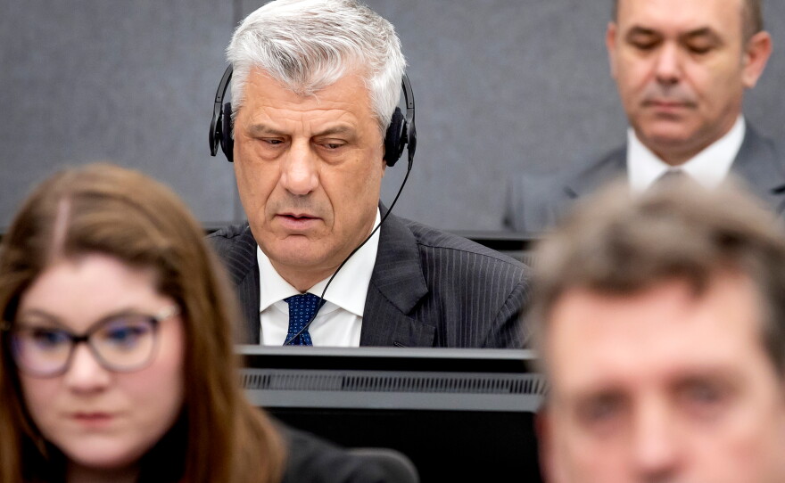 FILE - Former Kosovo president Hashim Thaci, top left, appears before the Kosovo Tribunal as he defends himself against charges including murder, torture and persecution allegedly committed during his country's war for independence from Serbia in the Hague, on April 3, 2023.
