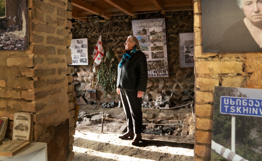 Lia Chlachidze stands in the occupation museum in the basement of her house in Ergneti, Georgia, which sits within a few hundred yards of the boundary of South Ossetia.