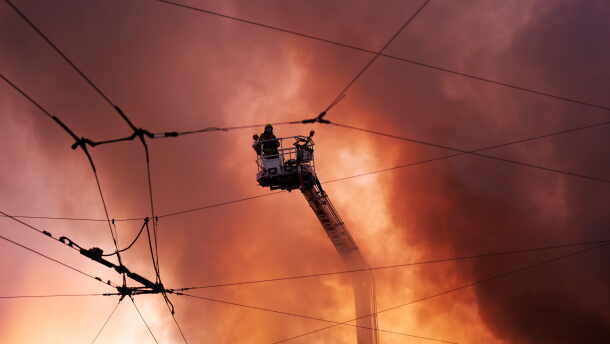 Firefighters try to put out a fire at a city book market following a Russian missile attack in Kyiv, Ukraine early Sunday, Aug. 16, 2026.