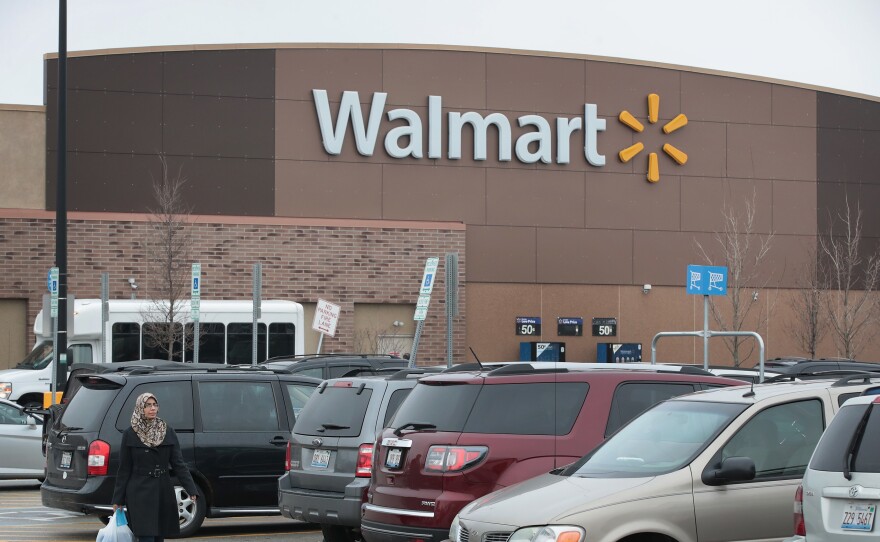 Customers shop at a Walmart store in January 2017 in Skokie, Ill.