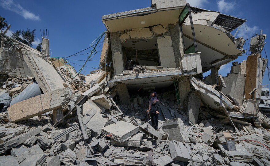 Hanan Qubaisi on Wednesday inspects her house destroyed in previous Israeli airstrikes in the town of Nabatiyeh, southern Lebanon, amid a fragile ceasefire between Israel and Hezbollah.