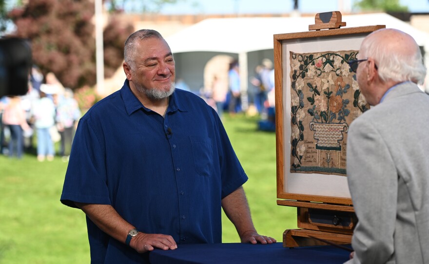 Allan Katz (right) appraises an 1834 St. James Episcopal Church sampler in Salt Lake City, UT. ANTIQUES ROADSHOW “Red Butte Garden & Arboretum, Hour 2” premieres Monday, Jan. 12, 2026 at 8/7C PM on PBS.