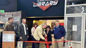 Jim Berg, Sharon Dunn, and Lenny Leszczynski handle the official ribbon-cutting opening of the Berg Family Trust Library, Tuesday, at the San Diego Automotive Museum in Balboa Park, San Diego, Calif., January 16, 2024